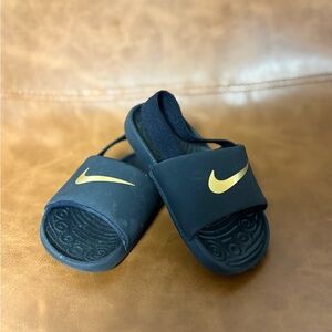 Nike Kids Black and Gold Slide Sandals